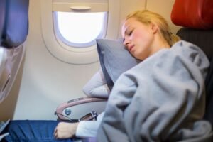 Sleep Expert Shares 11 Tips for Getting the Best Sleep on a Plane 